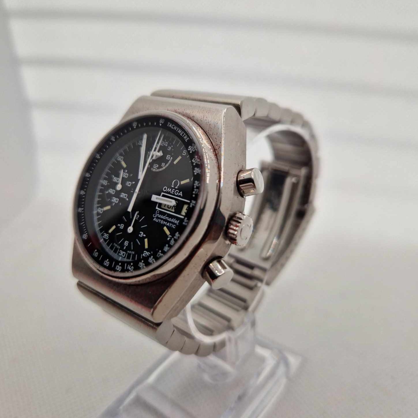 Side profile highlighting the pushers and crown of the Vintage Omega Speedmaster Mark 4.5.